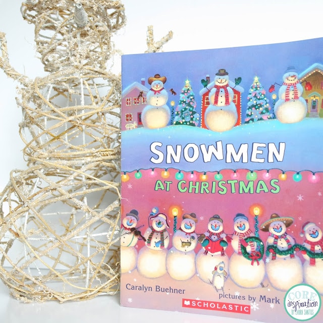 Snowmen At Christmas book cover next to snowman decoration 