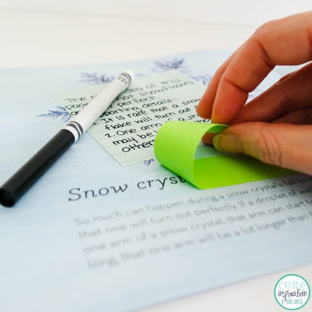 Post It Adhesive Roll being pulled of page of book.