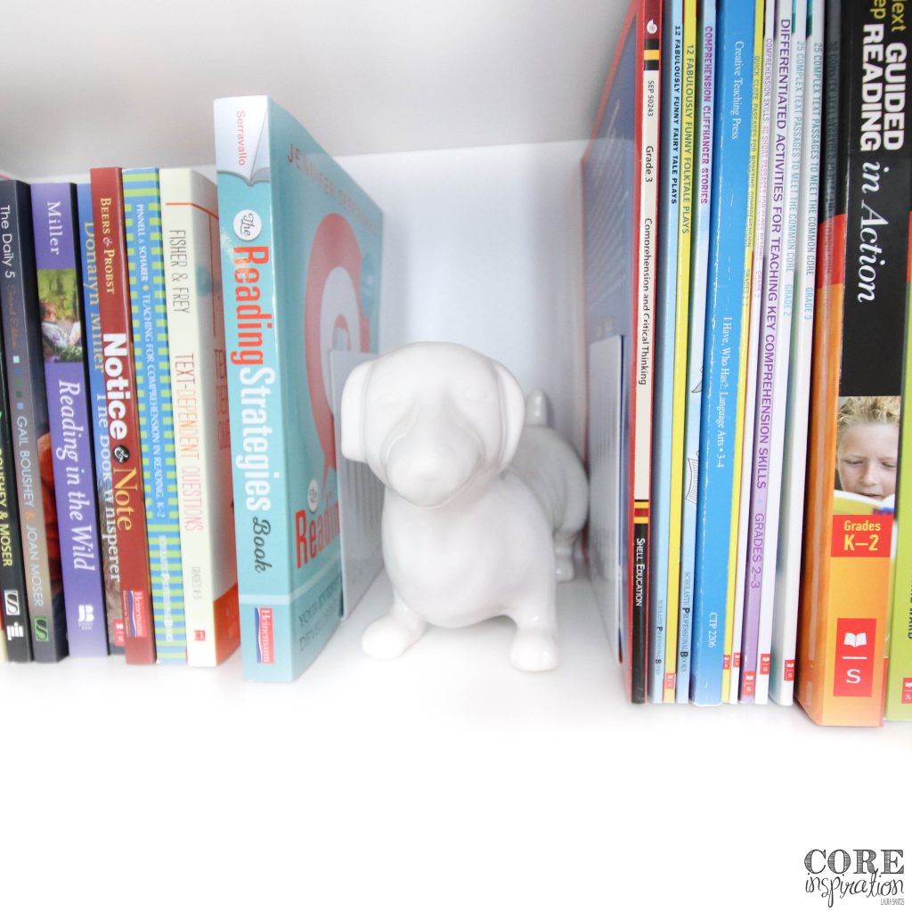 Teacher reference books organized on closet shelf by subject area for easy access.