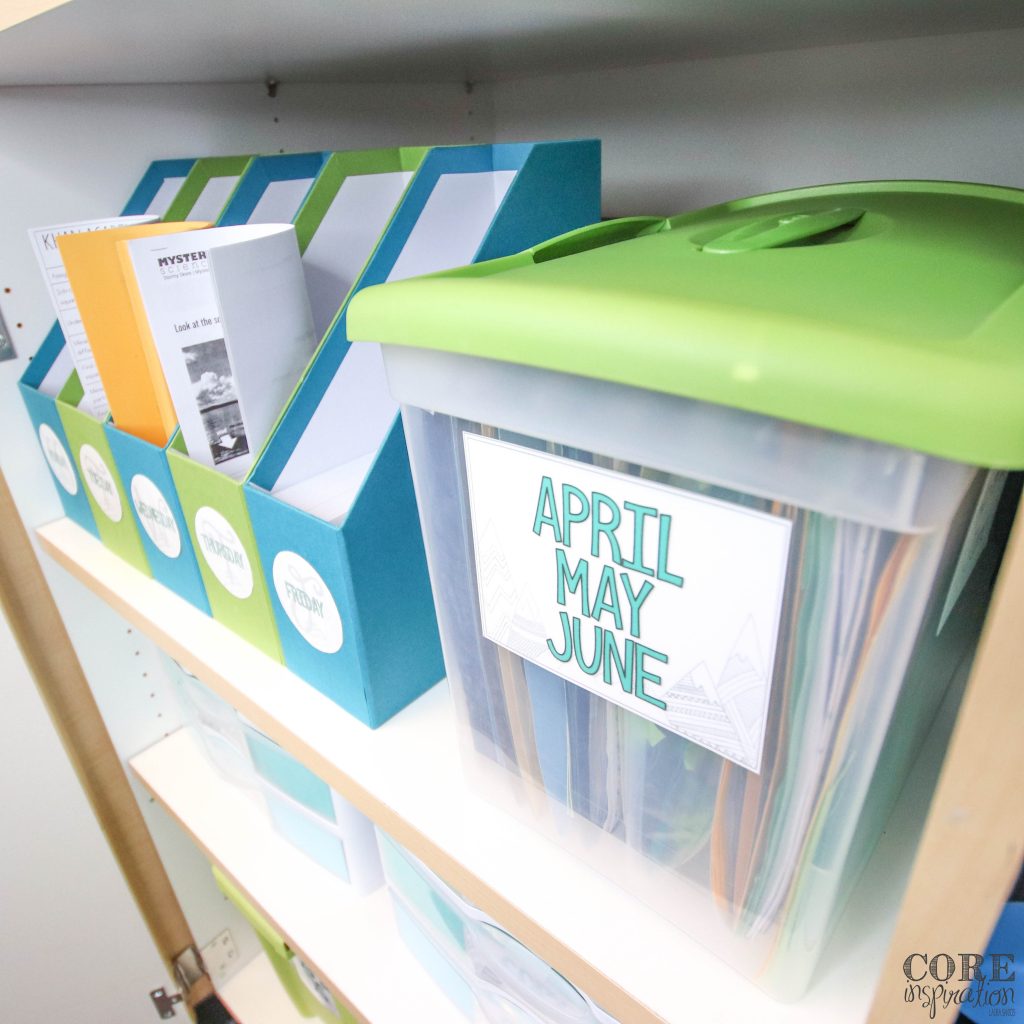 Monthly art project bin on classroom shelf next to day of the week bins to help teachers stay organized.