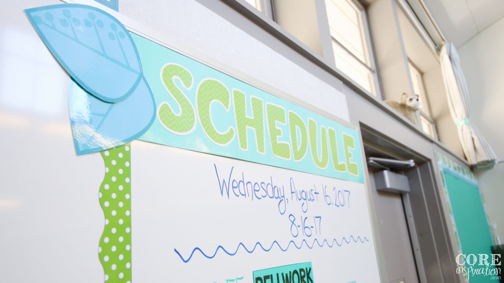 Consistent schedule displayed on classroom board.