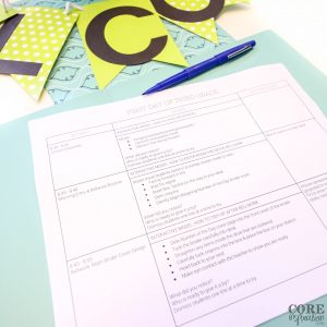 Third grade lesson plan on table in folder with classroom welcome banner overhead