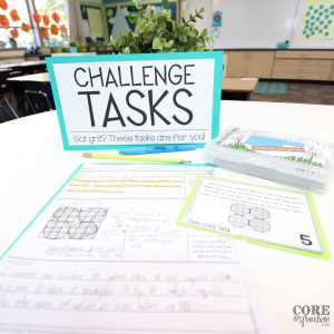 Core Inspiration problem solving challenge task sign next to challenging math problem solving task for third grade and sample recording sheet with model and math reasoning written in complete sentences.